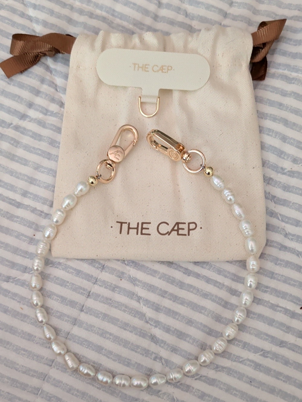 THE CAEP Freshwater Pearl Phone wristlet with Gold Accents